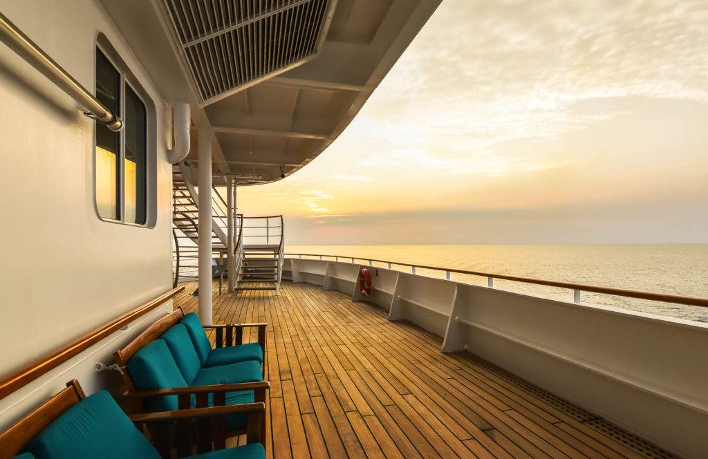 Luxury cruise ship deck at sunset. - ePaymentAmericaePaymentAmerica